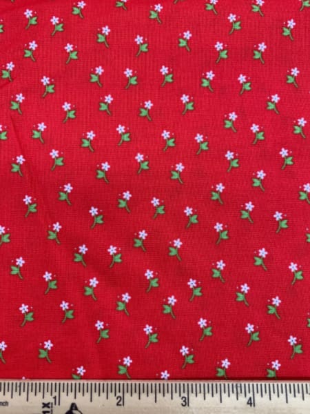 White flower on a red background quilting fabric from Riley Blake