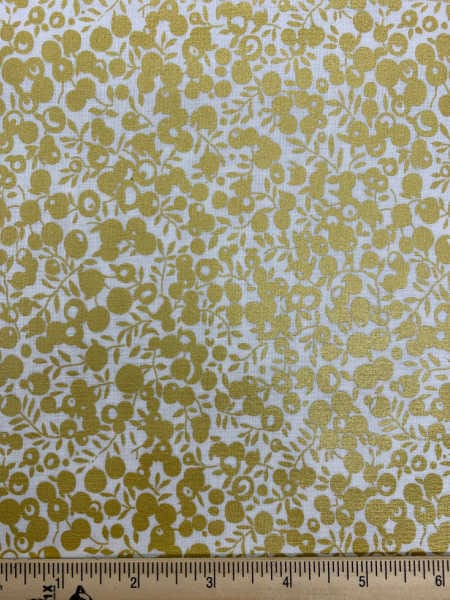 Wiltshire Shadow Gold Quilting Fabric from a festive collection by liberty london