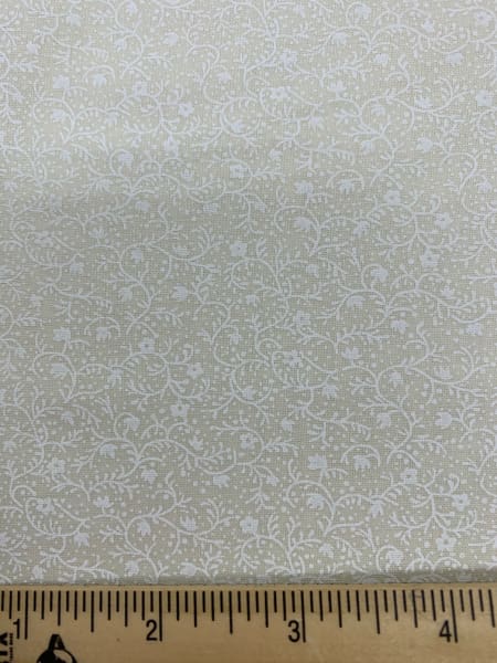 White floral print on cream background quilting fabric