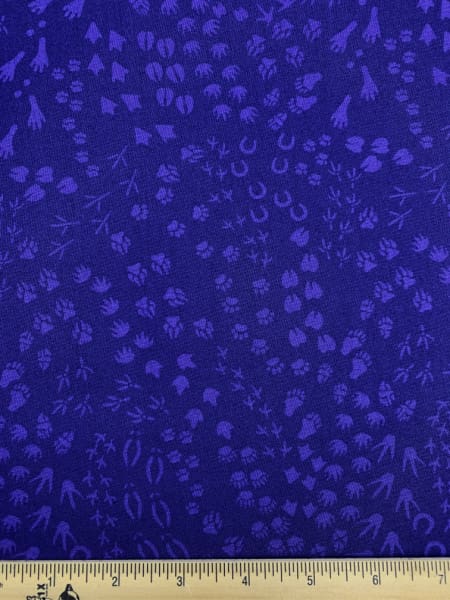 Animal Tracks quilting fabric in Purple from Migration by Lorraine Turner