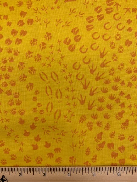 Animal Tracks In Yellow quilting fabric From Migration By Lorraine Turner for Free Spirit