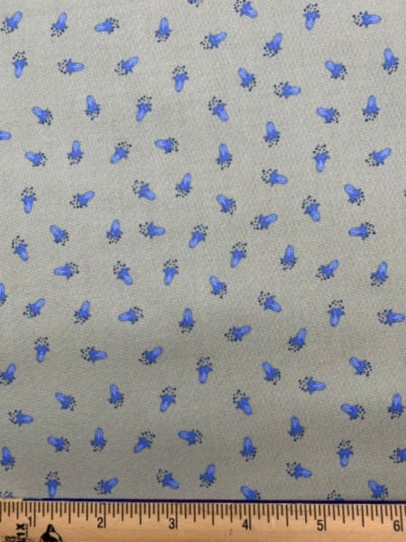 Scattered bluebells on soft green quilting fabric from Lewis and Irene UK
