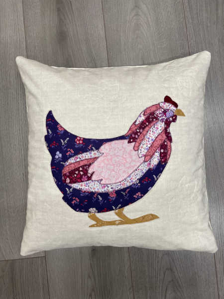A kit to make a Cushion with a chicken appliquéd on in Liberty Fabrics.
