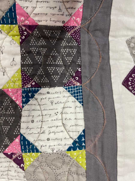 Quilt with fabric bleached from a water soluble pen