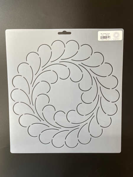 A feather design in a circle quilting stencil UK