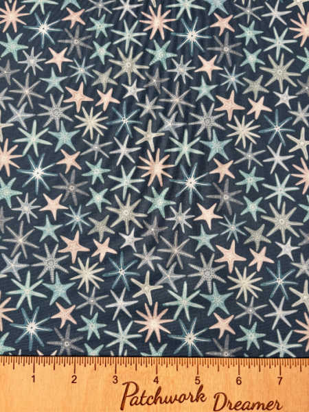 Multi starfish on dark blue with pearl quilting fabric from Lewis and Irene UK