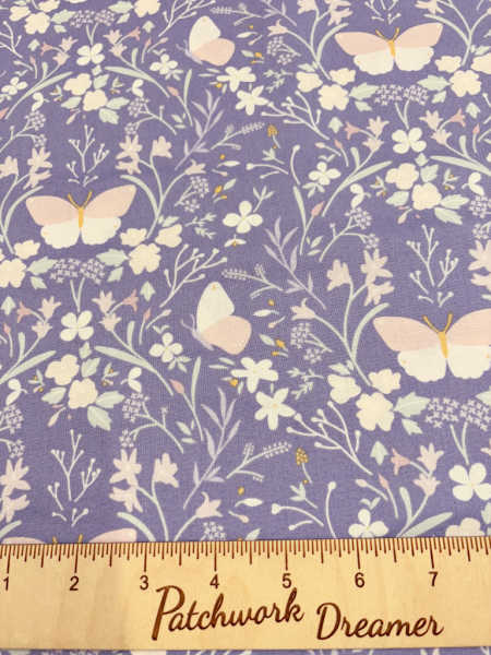 Floral gathering on dark hyacinth blue quilting fabric from the Heart of Summer collection by Cassandra Connolly for Lewis and Irene UK