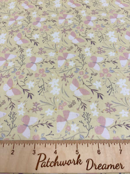 Butterfly dance on buttercup yellow quilting fabric from the Heart of Summer collection by Cassandra Connolly for Lewis and Irene UK
