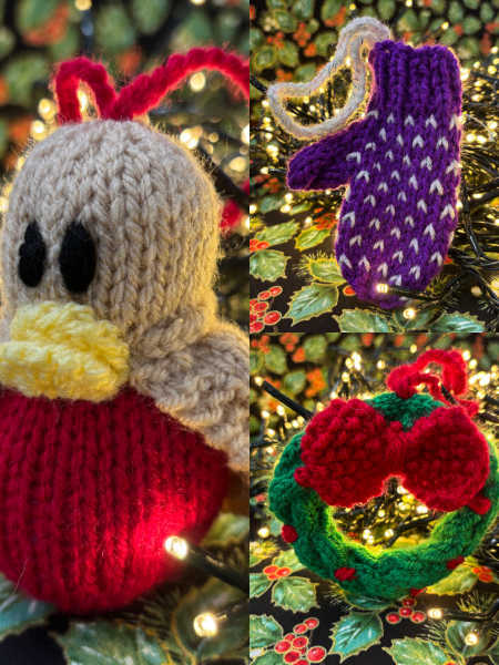 A festive collage of three hand-knitted Christmas decorations: a purple mitten with white details, a plump robin with a red breast and yellow beak, and a green wreath with a big red bow. All displayed against fairy lights and holly-patterned fabric, creating a warm holiday atmosphere