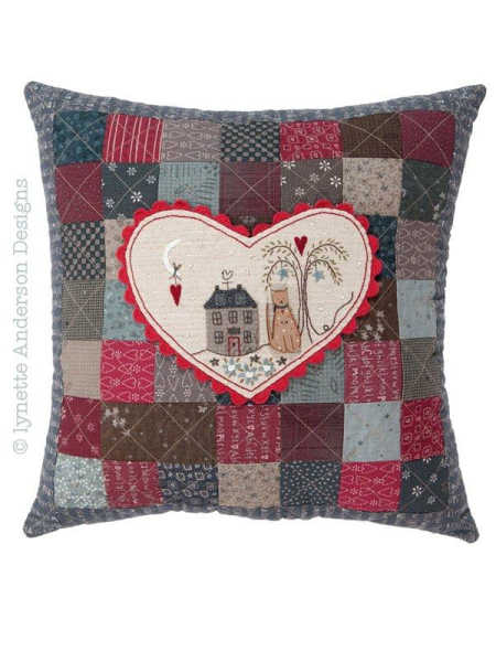 Lynette Anderson Heart & Home pillow pattern with patchwork squares and central appliqué heart design