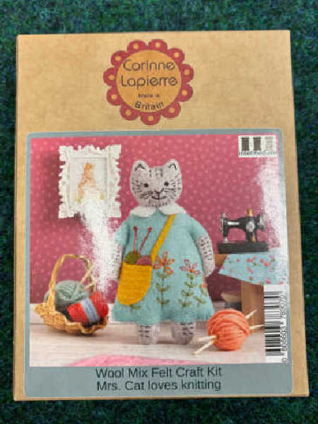 Corinne Lapierre Mrs Cat Loves Knitting felt kit showing a handmade felt cat in a blue dress holding a yellow knitting bag.
