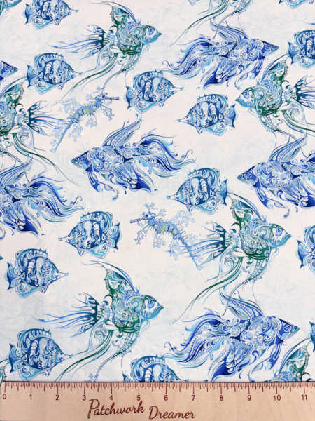Wonders of the Ocean fish quilting fabric by Jason Yenter for In the Beginning Fabrics UK, with blue and green patterned fish on a pale aqua background.