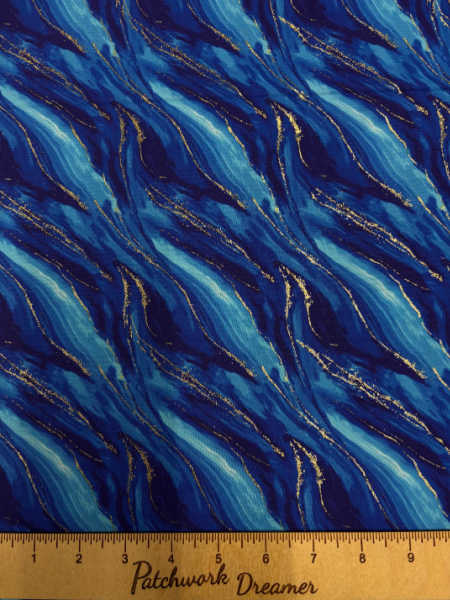 Camelot Gilded Waves quilting fabric UK in layered blue tones with metallic ink wave pattern