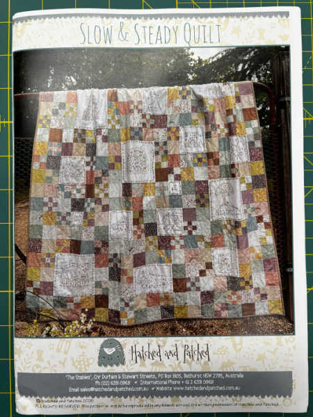Slow & Steady Quilt sewing pattern by Hatched and Patched showing patchwork quilt with embroidered panels and scrappy blocks UK