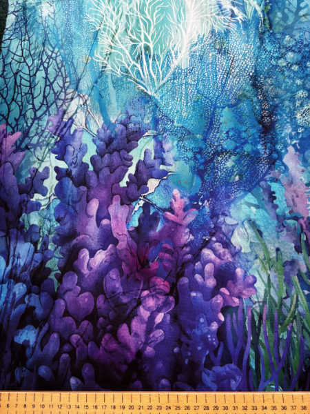 Close up of Coral Reef by Northcott seaweed and purple coral quilting fabric