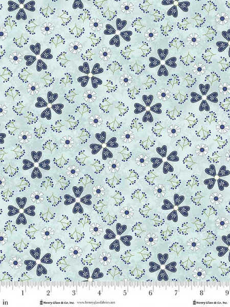 Light blue floral fabric with navy pinwheel flowers and small sprigs by Henry Glass UK