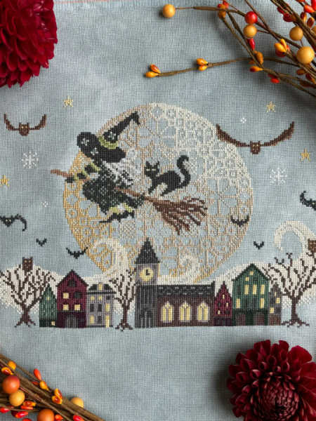 Love Poppet UK Night Rider cross stitch design with witch, moon, bats and Halloween village