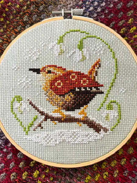 Love Poppet UK Wren and Snowdrops counted cross stitch kit design stitched on sage green Aida