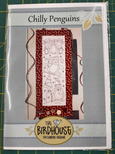 Chilly Penguins pattern by The Birdhouse, showing a redwork penguin wall hanging with a red fabric border, from Patchwork Dreamer, UK.