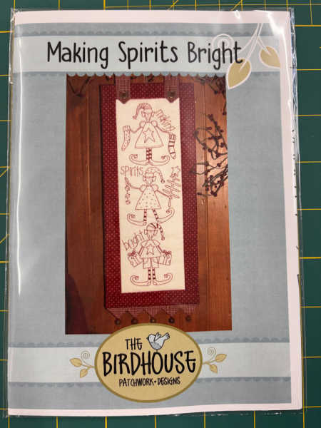 Making Spirits Bright pattern by The Birdhouse, showing a redwork Christmas elf wall hanging, available from Patchwork Dreamer, UK.